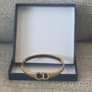 Gold-Tone Ribbed Hinged Bracelet with Double-Loop Accent